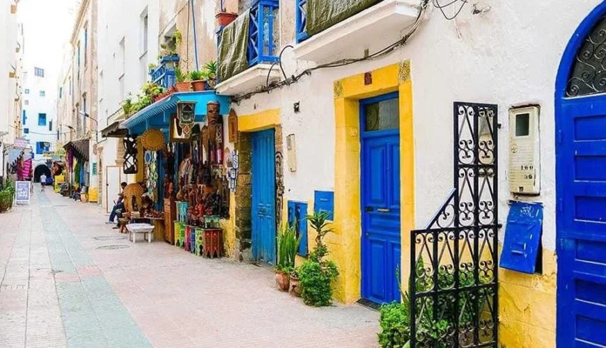 Spellbinding sunny day in Essaouira showcasing the vibrant blue and white medina, bustling fishing port, and serene beachfront