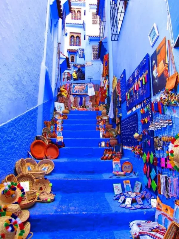 Comfortable shuttle van on a scenic road en route to the vibrant blue city of transfer Chefchaouen, Morocco.