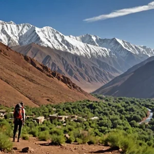 Ultimate Guide to Trekking in Morocco Atlas Mountains 2 Image showing a map with climate zones and a trekker hiking in the mountains.
